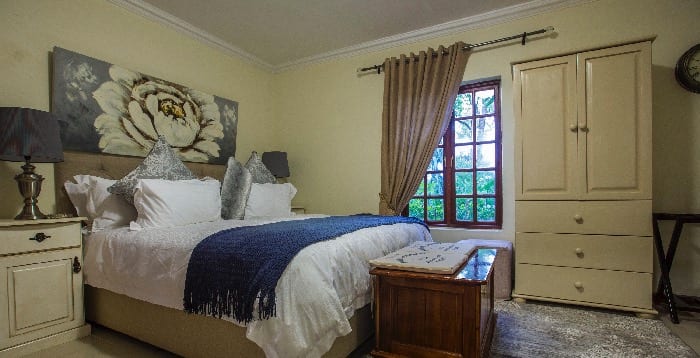 Guest bedroom with a navy throw