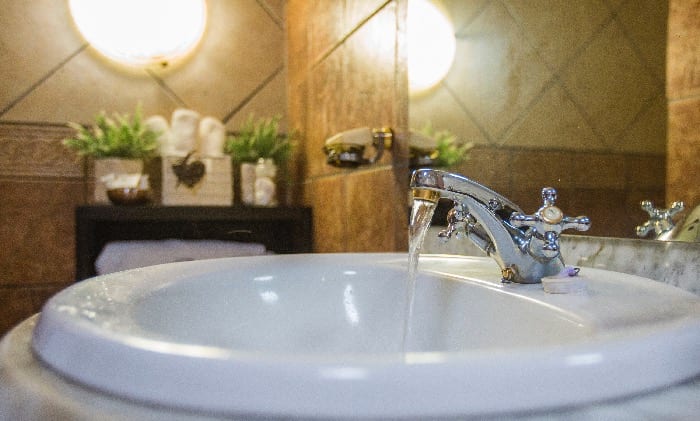 Bathroom basin with fresh flowers