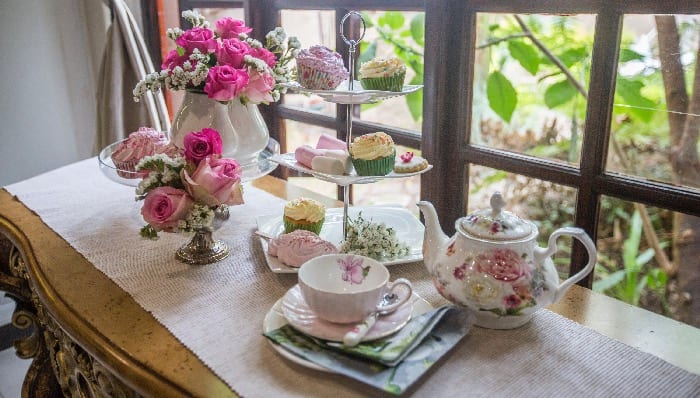 High tea table set with roses