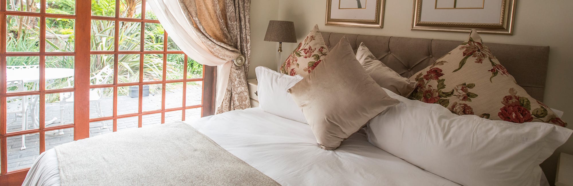 Guest bedroom with scatter cushions